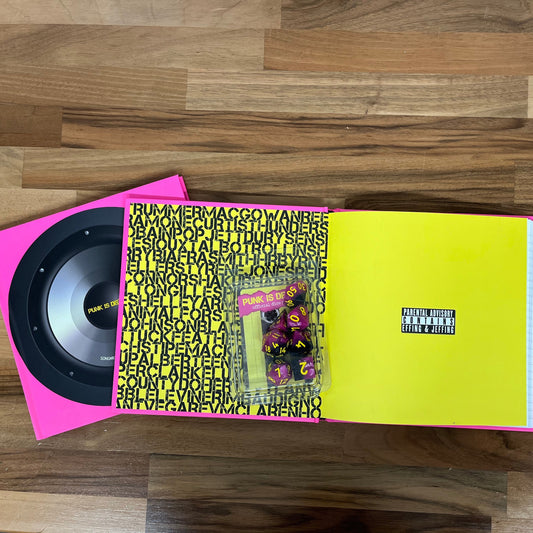 Vinyl record with a pink and yellow cover on a wooden surface
