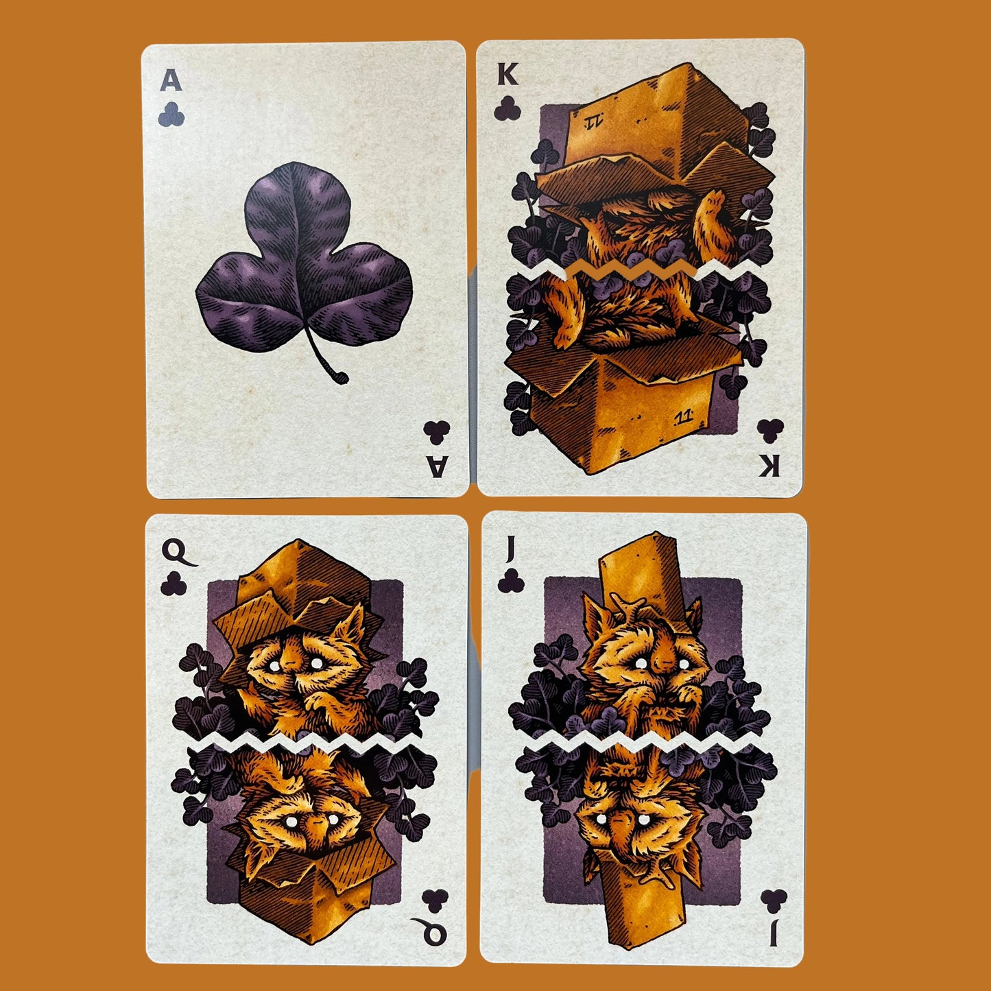 Wires in the Woods playing cards which are autumnal themed showing the court cards for the clubs