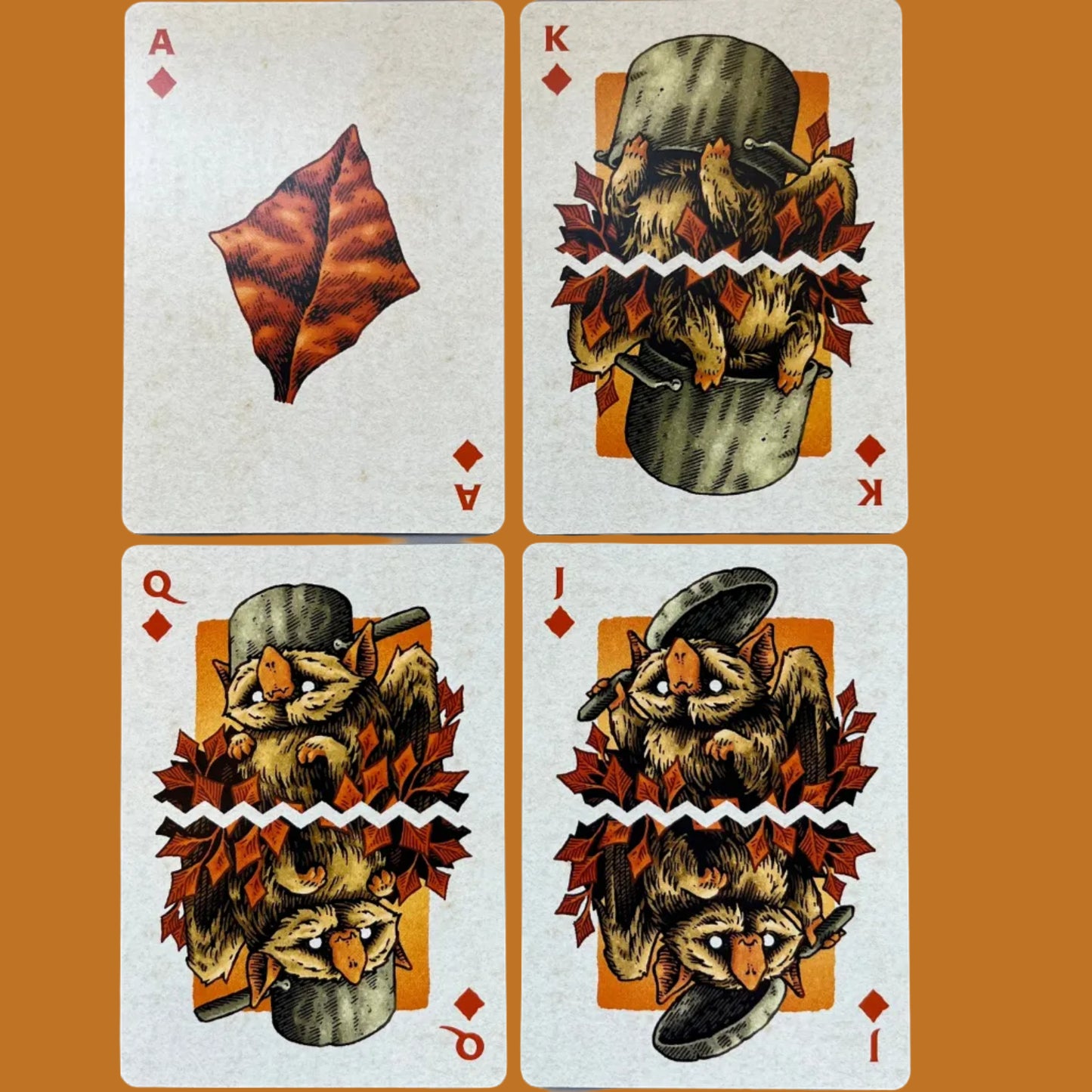 Wires in the Woods playing cards autumnal themed showing the diamond court cards illustrated with leaves and creatures created by Simon J Curd