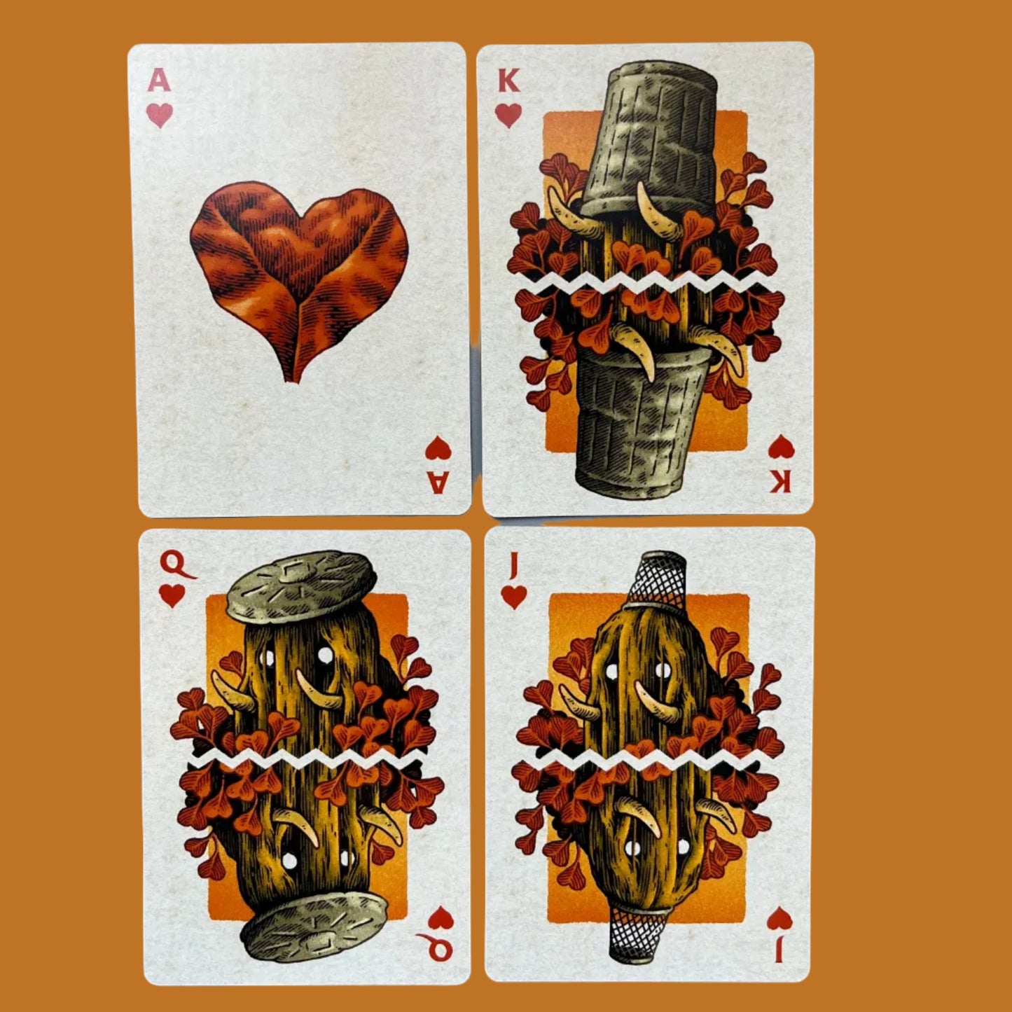 Wires in the Woods playing cards showing the hearts court cards, autumnal themed with leaves and creatures created by Simon J Curd
