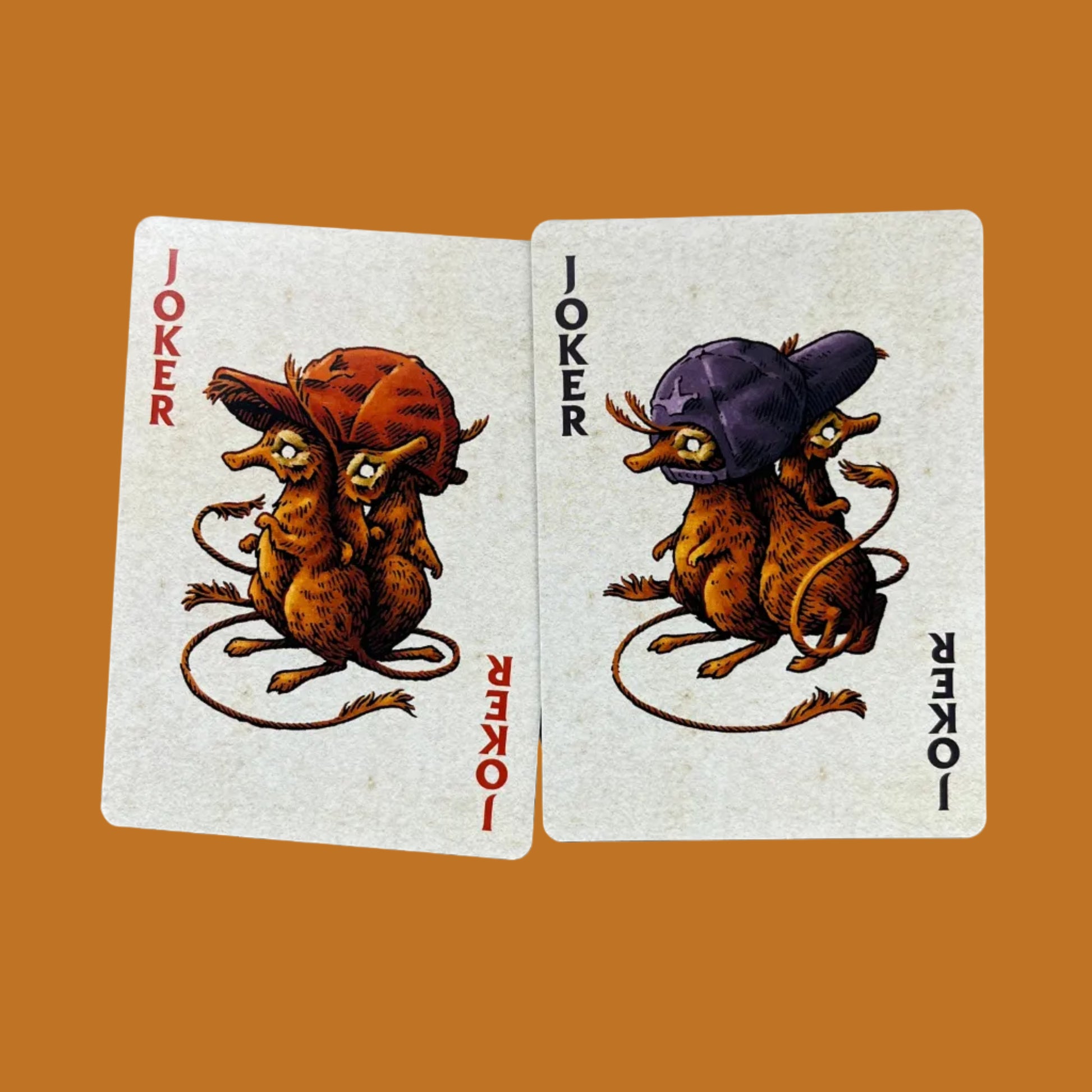 Wires in the Woods playing cards created by Simon J Curd showing the two joker cards with little creatures wearing baseball hats