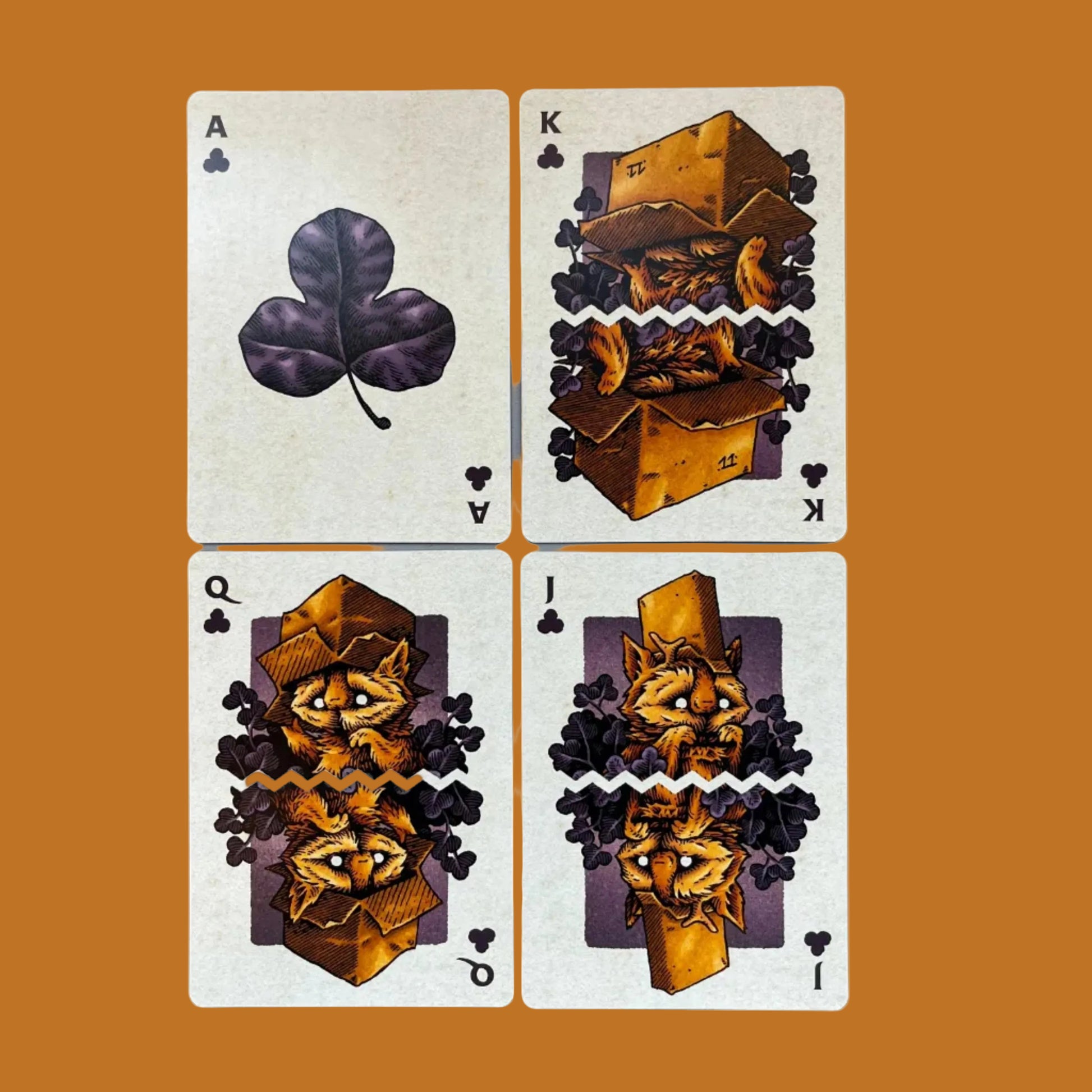 Wires in the Woods autumnal themed playing cards illustrated by Simon J Curd showing the club court cards as leaves and with little creatures