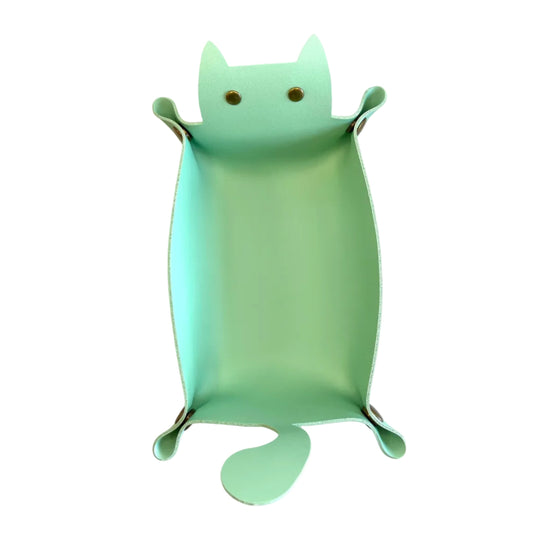 A mint green cat-shaped faux leather dice tray with small metal rivets on the ears and tail, photographed from above on a white background.