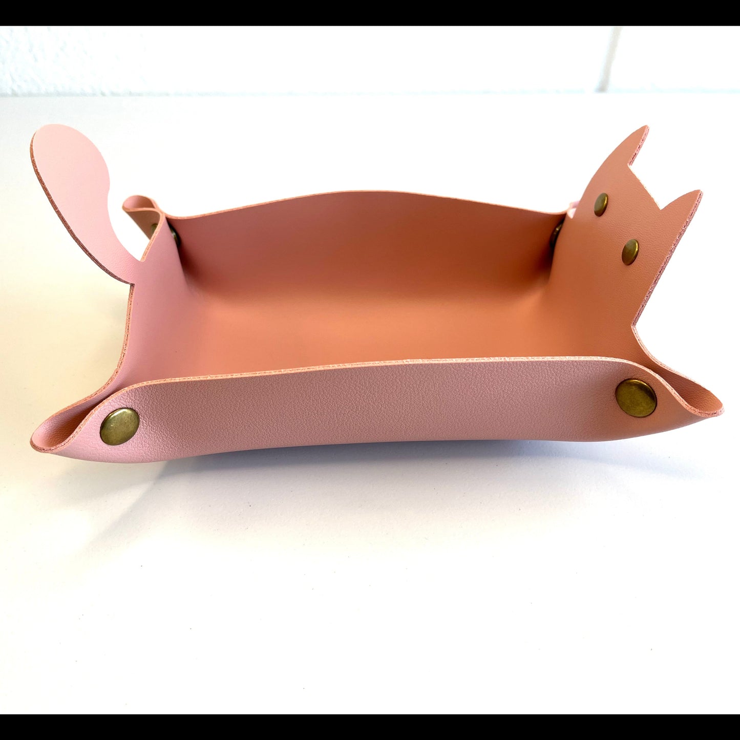 Pink Cat faux leather cat tray with brass rivets. on a white backgrounf
