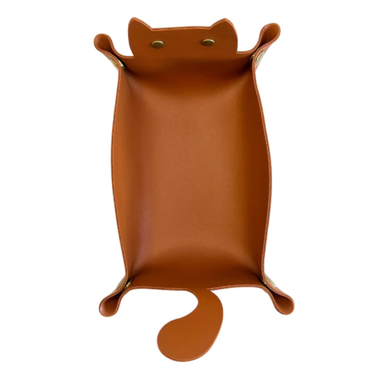 A brown faux-leather cat-shaped dice tray with a tail on the right side and metal rivets on the left, shown from a top-down view on a white background.