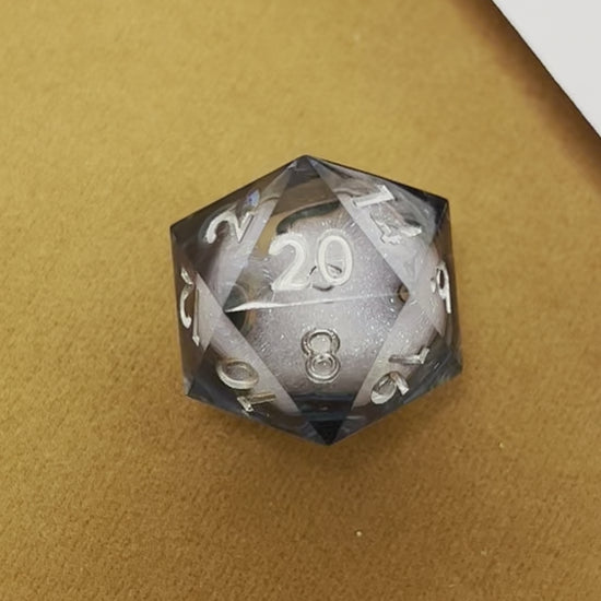 Sharp edged liquid core, polyhedral DnD dice for TTRPG and role playing games.