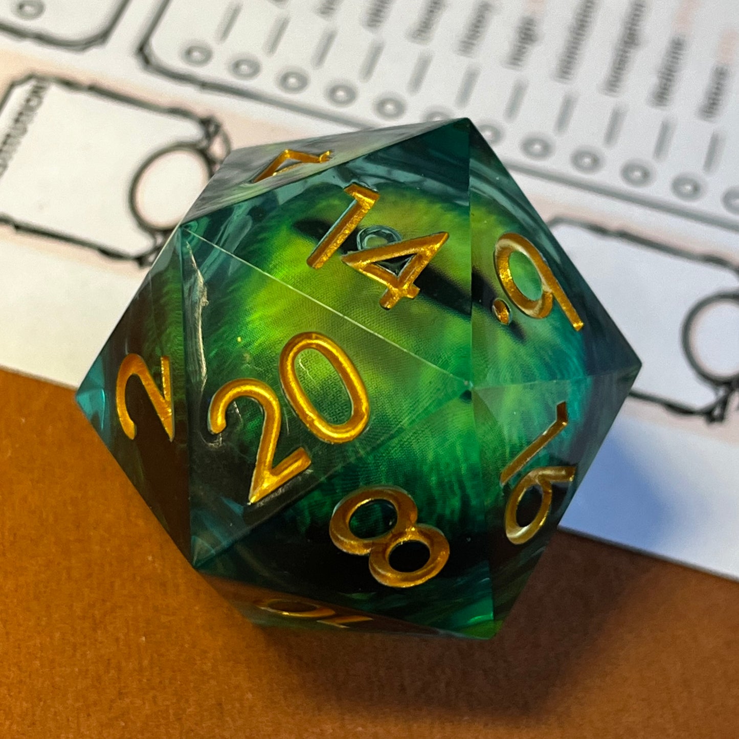Green eyes, dragon eye moving liquid core, dnd dice, TTRPG, role playing, role playing games
